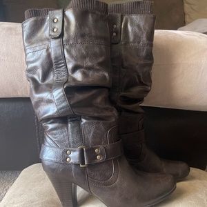 Faux leather slouch boot with sweater lining at the top.